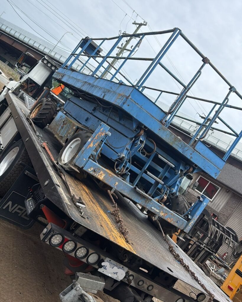 Commercial equipment secured on a flatbed transport truck