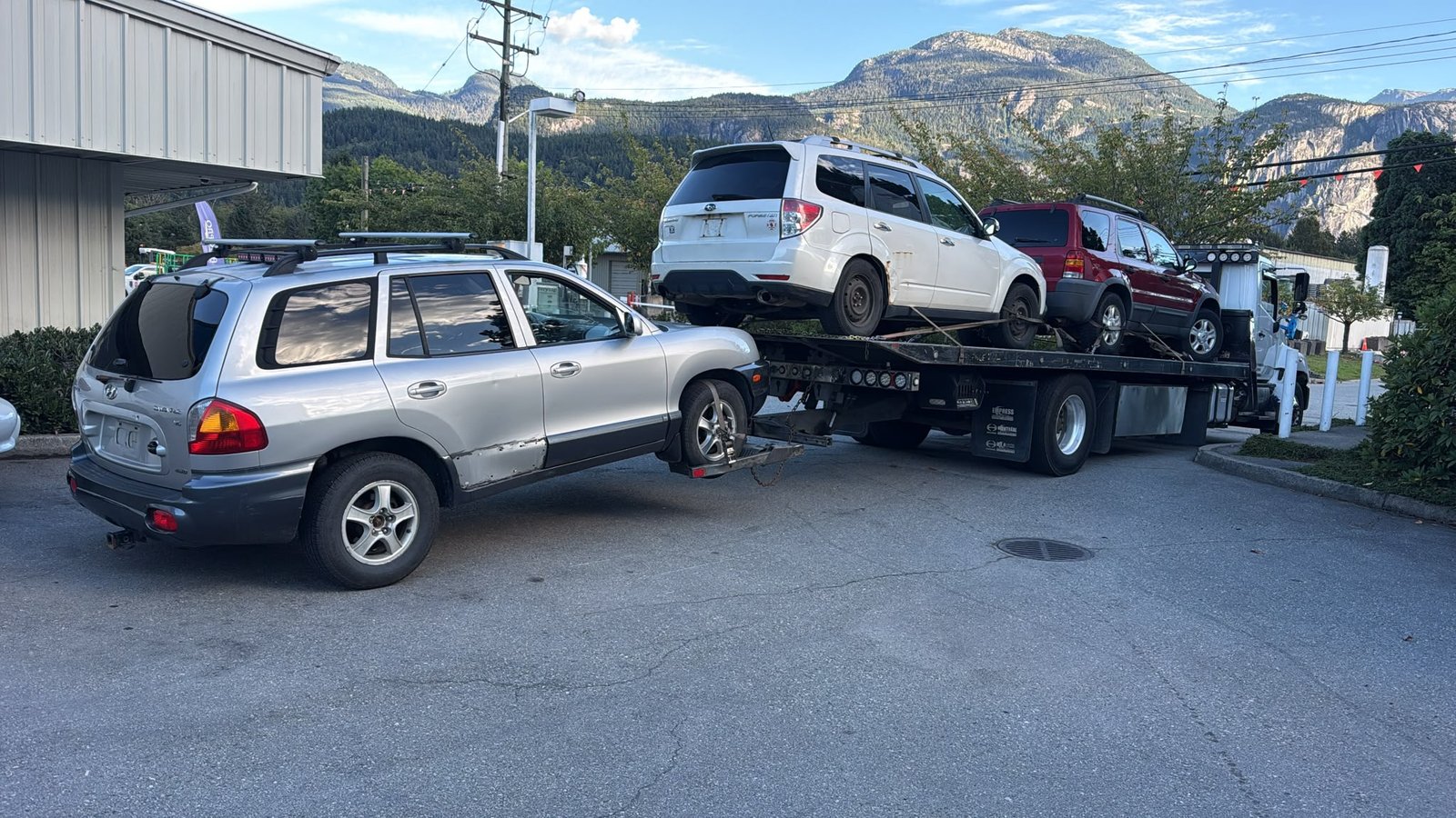 Scrap car removal in progress in Langley